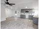 Modern gray kitchen with new appliances and flooring at 6952 Sw 85Th Pl, Ocala, FL 34476