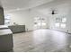 Spacious living area with wood-look floors and lots of natural light at 6952 Sw 85Th Pl, Ocala, FL 34476