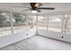 Sunroom with ceiling fan and view of backyard at 6952 Sw 85Th Pl, Ocala, FL 34476