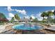 Resort-style pool with lounge chairs and palm trees at 7049 Carib Grackle Dr, St Cloud, FL 34773