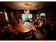 Dining room with hardwood floors, oval table, and floral wallpaper at 824 Lake Elbert Ct, Winter Haven, FL 33881