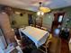 Dining room with table, chairs, and access to the pool at 824 Lake Elbert Ct, Winter Haven, FL 33881