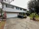 Two story home with brick and white siding at 824 Lake Elbert Ct, Winter Haven, FL 33881