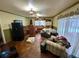 Gathering room with hardwood floors and a wood burning stove at 824 Lake Elbert Ct, Winter Haven, FL 33881