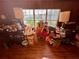 Living room with hardwood floors and large window at 824 Lake Elbert Ct, Winter Haven, FL 33881