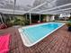 Refreshing rectangular pool under a covered patio at 824 Lake Elbert Ct, Winter Haven, FL 33881