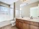 Bathroom with double vanity and walk-in shower at 8276 Maritime Flag St # 201, Windermere, FL 34786