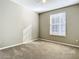 Bright bedroom with carpeted floor and window coverings at 8276 Maritime Flag St # 201, Windermere, FL 34786