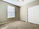 Spacious bedroom with neutral walls and double door closet at 8276 Maritime Flag St # 201, Windermere, FL 34786