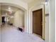 Interior hallway with arched doorways and decorative benches at 8276 Maritime Flag St # 201, Windermere, FL 34786