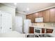 Bright kitchen with wood cabinets and stainless steel sink at 8276 Maritime Flag St # 201, Windermere, FL 34786