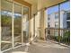 Screened balcony with sliding glass doors and view at 8276 Maritime Flag St # 201, Windermere, FL 34786