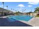 Resort-style pool with spacious deck and lounge chairs at 8276 Maritime Flag St # 201, Windermere, FL 34786