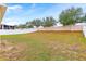 Fenced backyard with mature trees at 841 Greenshank Dr, Haines City, FL 33844