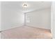 Simple bedroom with neutral walls and carpet at 841 Greenshank Dr, Haines City, FL 33844