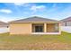 House with covered patio and fenced backyard at 841 Greenshank Dr, Haines City, FL 33844