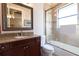 Bathroom with granite vanity, shower, and tub at 9213 Foxhall Ct, Orlando, FL 32819