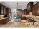 Large kitchen boasts granite countertops and ample wood cabinetry at 9213 Foxhall Ct, Orlando, FL 32819