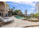 Relaxing pool and spa with lake views and comfortable lounge chairs at 9213 Foxhall Ct, Orlando, FL 32819