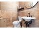 Elegant powder room with pedestal sink and decorative tile at 9213 Foxhall Ct, Orlando, FL 32819