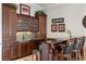 Wet bar with granite countertop and cabinetry at 9213 Foxhall Ct, Orlando, FL 32819