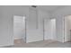 Bright bedroom with neutral carpeting and walk-in closet at 925 Magnolia Ave, Holly Hill, FL 32117