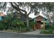 Exterior view of Hurricane Dockside Grill with lush landscaping at 9556 Starling Loop, Leesburg, FL 34788