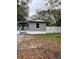 Mobile home exterior with covered porch and fenced yard at 9868 6Th Ave, Orlando, FL 32824