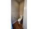 Simple bathroom with toilet and wood-look flooring at 10 Moree Loop # 1, Winter Springs, FL 32708