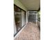 Spacious screened-in porch with tile flooring at 10 Moree Loop # 1, Winter Springs, FL 32708