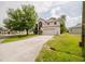 Charming two-story home featuring an attached two-car garage and well-maintained lawn at 1010 Embrun Ct, Kissimmee, FL 34759