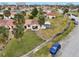 Aerial view of a home and neighborhood with palm trees at 106 Cardinal Dr # D, Ormond Beach, FL 32176