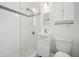 Clean bathroom with a walk-in shower, white vanity, and medicine cabinet at 106 Cardinal Dr # D, Ormond Beach, FL 32176