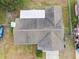 Top-down view of a house roof and surrounding yard at 1062 Blue Horizon Dr, Deltona, FL 32725