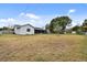 House backyard view with large grassy area at 1062 Blue Horizon Dr, Deltona, FL 32725