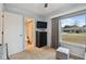 Bedroom with dresser, ottoman, and large window at 1062 Blue Horizon Dr, Deltona, FL 32725