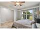 Bedroom with double bed, large window, and ceiling fan at 1062 Blue Horizon Dr, Deltona, FL 32725