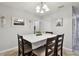 Bright dining room features a table with four chairs, and decorative wall accents at 1062 Blue Horizon Dr, Deltona, FL 32725