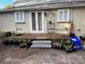 Wooden back porch with steps leading to the backyard at 113 W 19Th St, Sanford, FL 32771