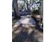 Backyard with gravel area and partial view of surrounding trees at 113 W 19Th St, Sanford, FL 32771