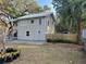 Newly painted house exterior with a metal roof and a fenced yard at 113 W 19Th St, Sanford, FL 32771