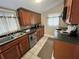 Kitchen with wood cabinets, stainless steel appliances, and granite countertops at 113 W 19Th St, Sanford, FL 32771