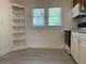 Bright kitchen with built-in shelving and tile flooring at 113 W 19Th St, Sanford, FL 32771