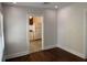 Living room with hardwood floors and a view into the kitchen at 113 W 19Th St, Sanford, FL 32771