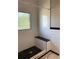 Updated shower with white subway tile, black hexagon floor, and built-in seat at 113 W 19Th St, Sanford, FL 32771