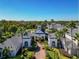 Aerial view of community clubhouse, showcasing manicured landscaping and inviting entrance at 130 Southern Pecan Cir # 102, Winter Garden, FL 34787