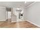 Well-lit kitchen with white cabinets and granite countertops at 130 Southern Pecan Cir # 102, Winter Garden, FL 34787