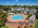 Aerial view of a large community pool area with lounge chairs and landscaped surroundings at 130 Southern Pecan Cir # 102, Winter Garden, FL 34787