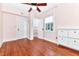 Pink bedroom with hardwood floors, ceiling fan and closet at 1300 E Kaley St, Orlando, FL 32806