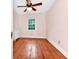 Pink bedroom with hardwood floors and ceiling fan at 1300 E Kaley St, Orlando, FL 32806